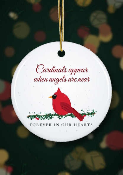 Cardinals Appear When Angels Are Near memorial ornament hanging on a Christmas tree
