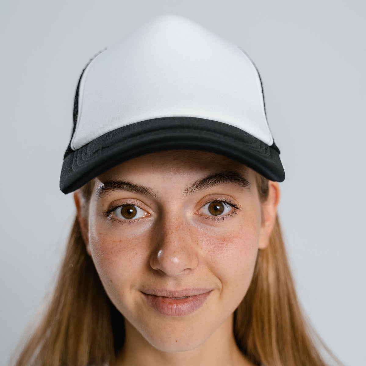 Woman wearing a custom trucker hat