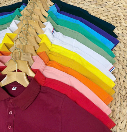 Polo shirts in many colors on hangers