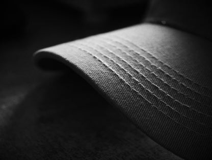 Close-up of precise stitching on a hat brim