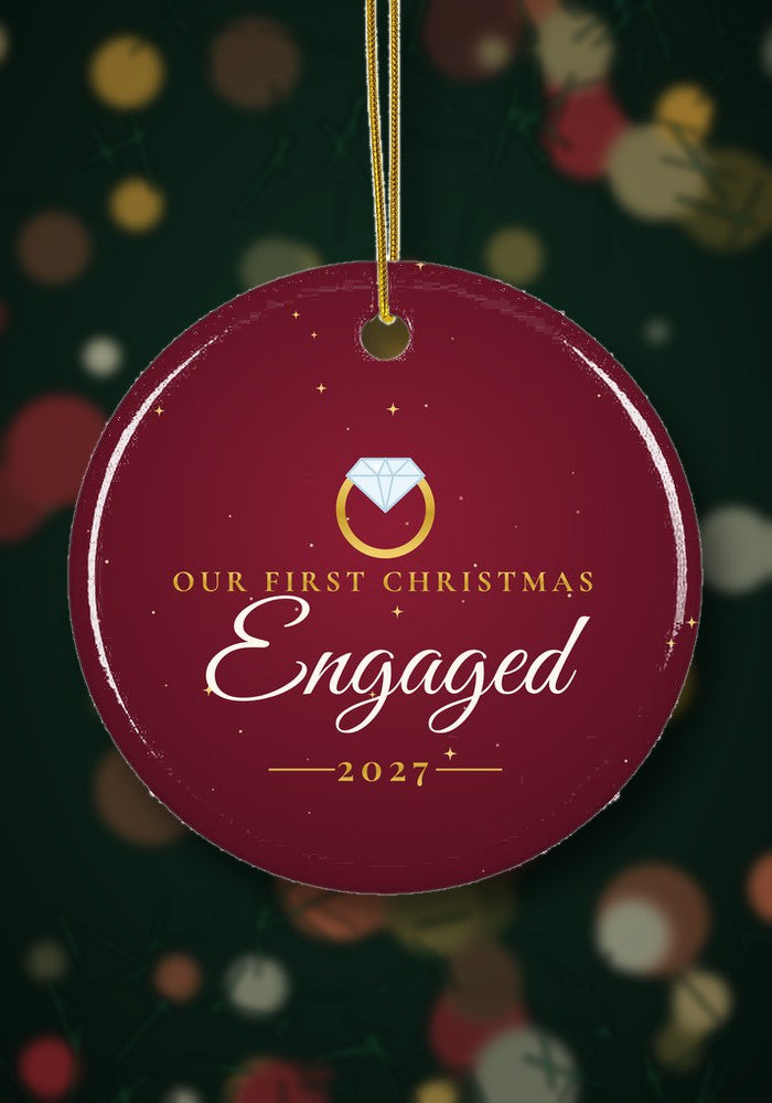 Our First Christmas Engaged ornament hanging on a Christmas tree