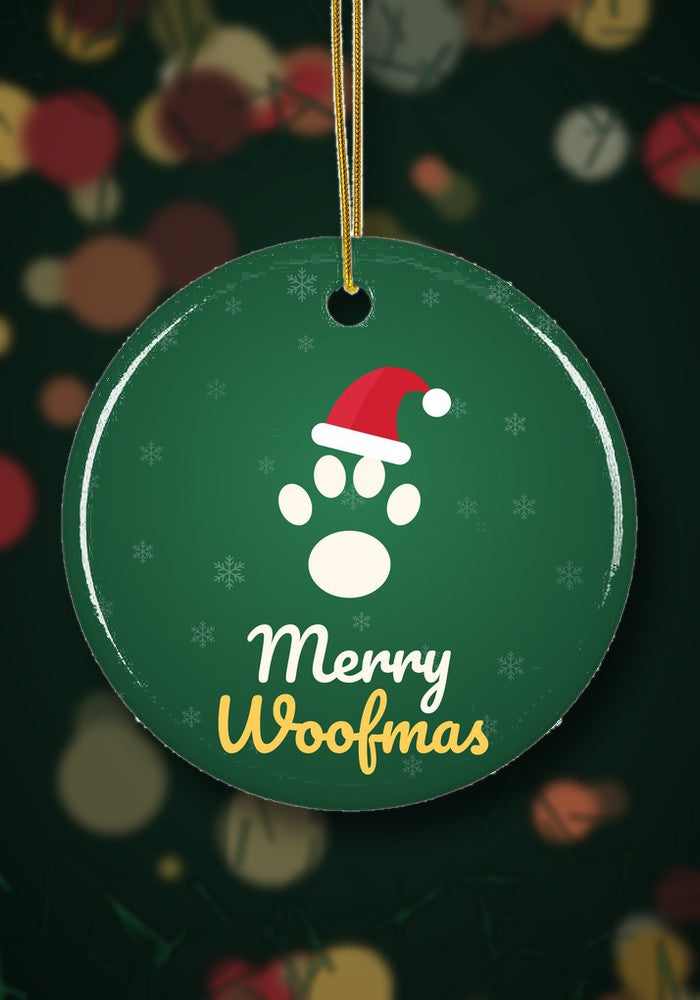 Merry Woofmas Dog Paw ornament hanging on a Christmas tree