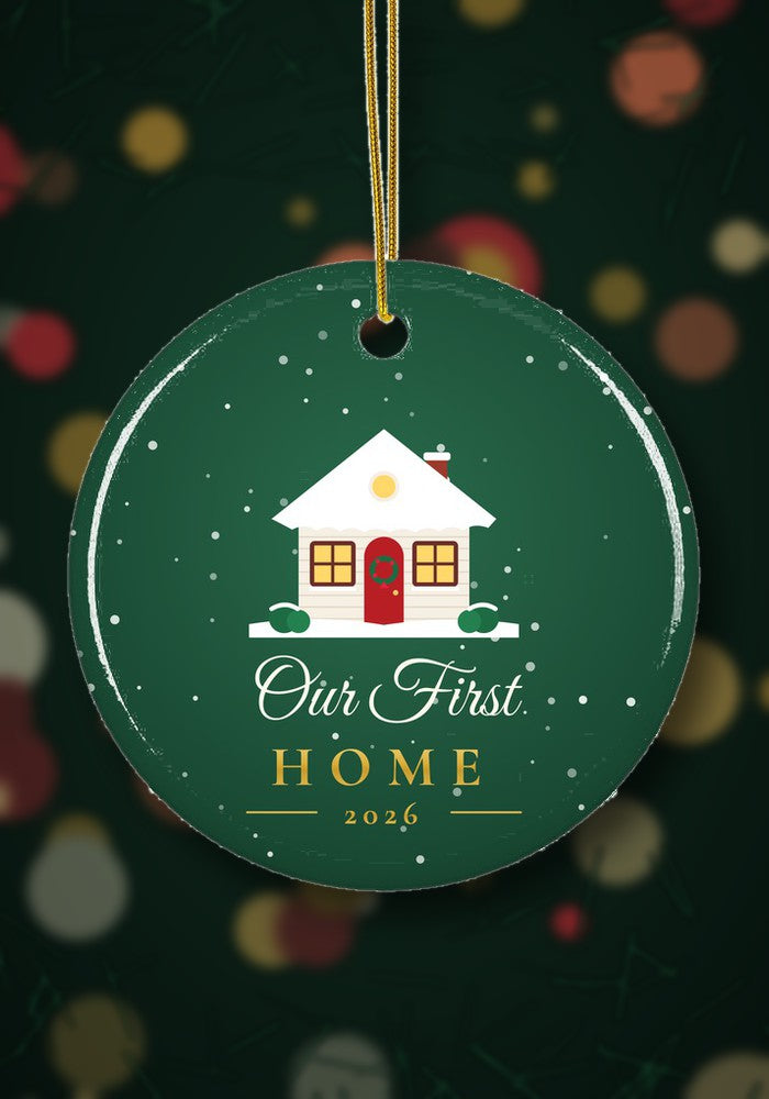 Our First Home 2026 ornament hanging on a Christmas tree