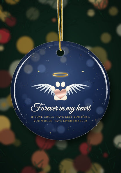 Pet memorial ornament with angel paw hanging on a Christmas tree